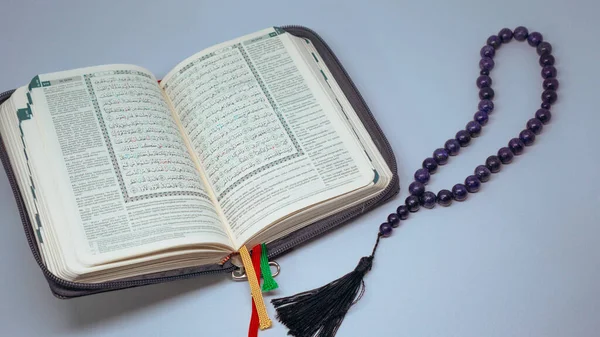 stock image Manuscript Holy Quran Holy Koran and Muslim prayer beads isolated in white background