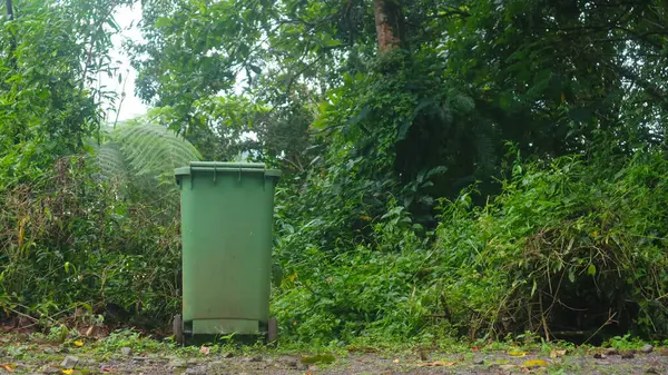 green trash bins in tourist spots