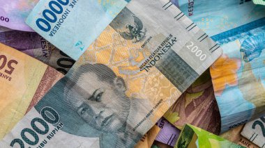 Arkaplan olarak rupiah banknotları yığını