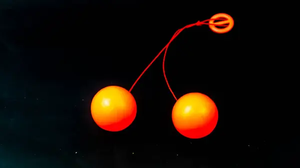 Orange Lato Lato Spielzeug Auf Schwarzem Hintergrund — Stockfoto