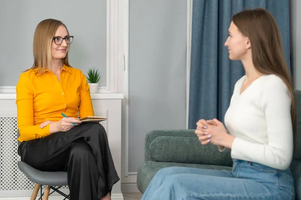 stock image Young smiling woman is being interviewed for a job. Concept of employment, business, consultations