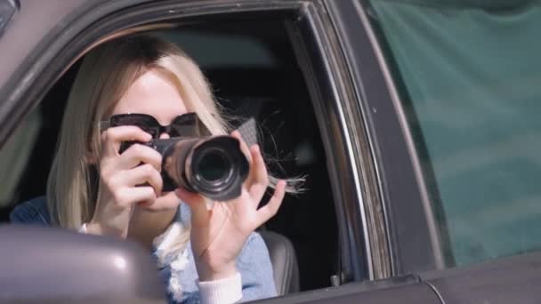 Woman Camera Sits Car Takes Photo Professional Camera Private Detective — Stock Video