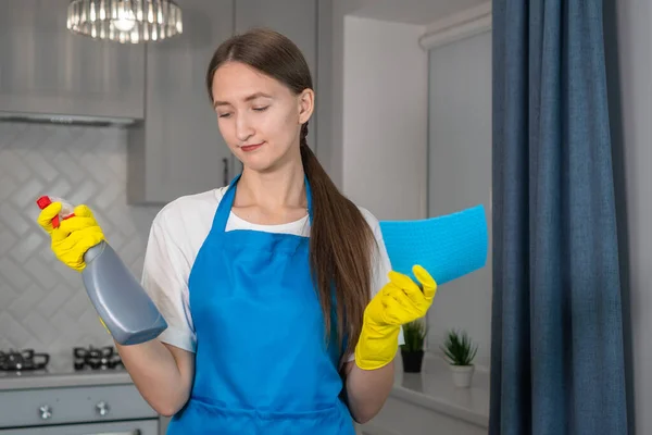 Woman Uniform Apron Holds Cleaning Agent Microfiber Cloth Her Hands — Stock Photo, Image