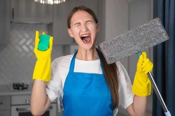 Young Woman Uniform Apron Holds Mop Sponge Her Hands She — Stock Photo, Image