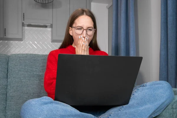 Young Woman Red Sweater Glasses Yawns Sitting Laptop Couch Girl — Stock Photo, Image