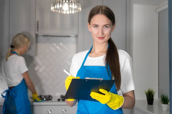 Close Beautiful Young Cleaning Woman Looking Camera Checking List Paper — Stock Photo, Image