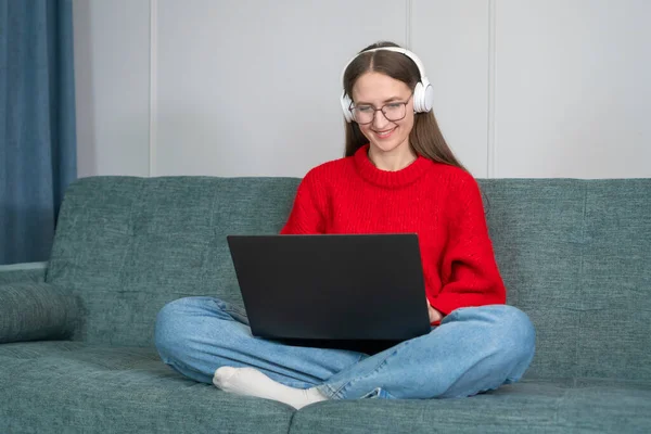 Happy Young Beautiful Woman Red Sweater White Headphones Sitting Couch — Stock Photo, Image