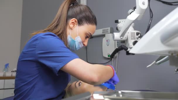 Dentist Hands Gloves Dental Punch Cofferdam Scarf Dentist Treats Woman — Stock Video