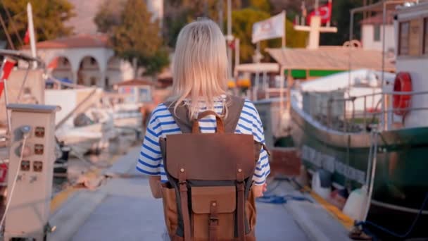 Young Beautiful Slender Blonde Woman Backpack Sunglasses Walking Pier Background — Stock Video