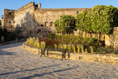 Public park and fragment of Sohail Castle in the background. Fuengirola, Costa del Sol, Malaga province, Andalusia, Spain.
