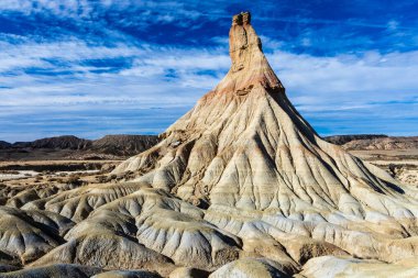 Castildetierra hill in a semi-desert area, an incredible and unique geological formation shaped like a cone, eroded by water and wind. Bardenas Reales natural park, Navarra, Spain. clipart