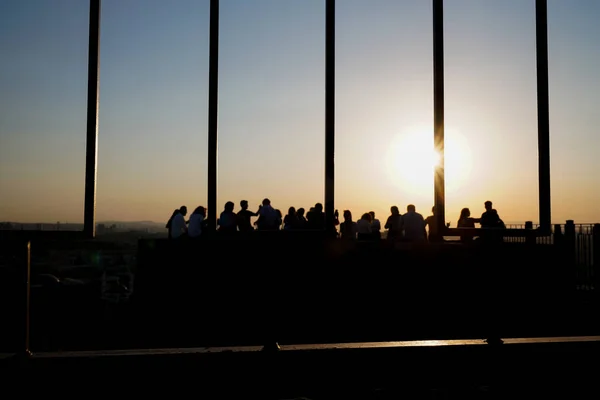silhouette of people during sunset