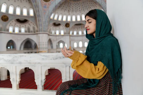 Muslim woman praying in the mosque during Ramadan