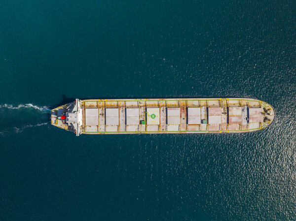 Aerial view of freight ship with cargo containers
