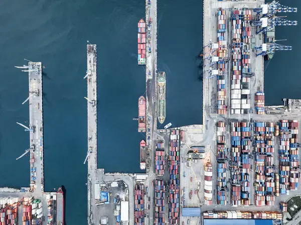 stock image Aerial top view of Container ship loading and unloading, Cargo container in deep seaport for the international order concept.