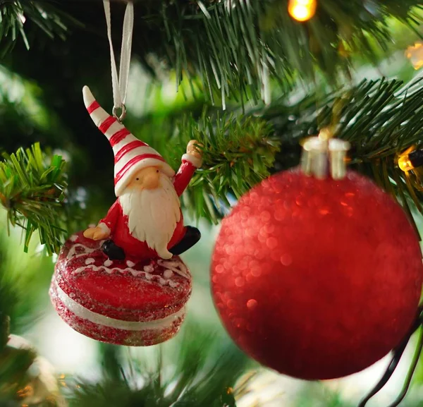 closeup view of christmas decorations with red and white baubles, on a dark background