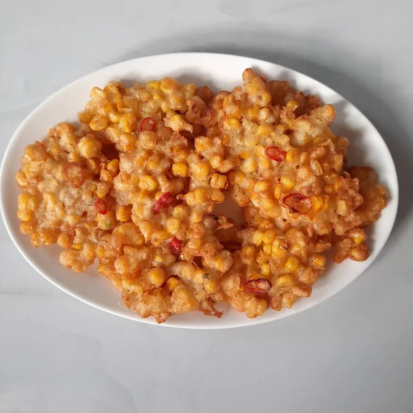 Corn cakes or also called corn fritters are foods made from corn, flour, chicken eggs and fried. This food comes from Indonesia