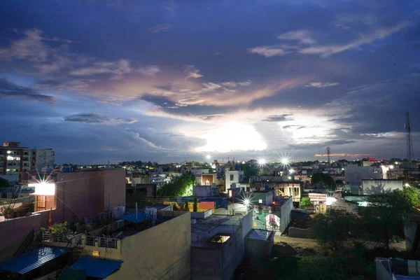 top view of city from terrace , raipur, chhattisgarh ,india, A beautiful evening view in beautiful climate or weather, time after sunsets in eve, relaxing clouds in blue, white and orange, lights on