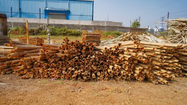 Beautiful wood kept in pattern creating a background, Storage place for wood logs Stack of logs natural wooden background with timber log pile of timber,Logging timber wood industry, sawn wooden plank