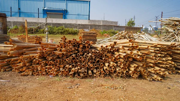 Beautiful wood kept in pattern creating a background, Storage place for wood logs Stack of logs natural wooden background with timber log pile of timber,Logging timber wood industry, sawn wooden plank