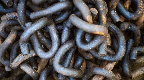 Close up of rusted metal chains, Rusty Chain Images,Chains of the past pile up in a heap, Brown metal chains with rust n ground, textures of metal material, junk waste of industries and constructions