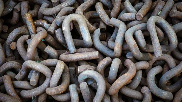 Close up of rusted metal chains, Rusty Chain Images,Chains of the past pile up in a heap, Brown metal chains with rust n ground, textures of metal material, junk waste of industries and constructions