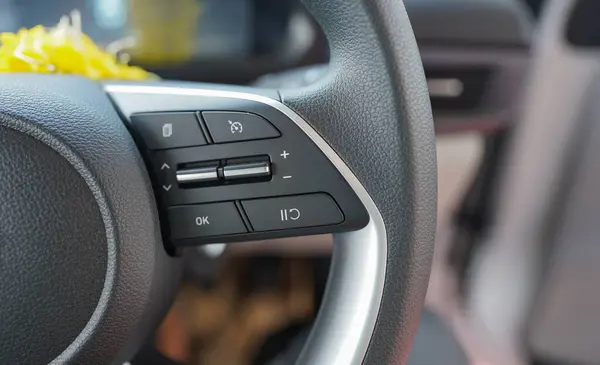 stock image Close-up of Modern Car Steering Wheel with Controls, High-Resolution Image of Car Steering Wheel Buttons, Stock Photo of Sleek Car Steering Wheel Design,