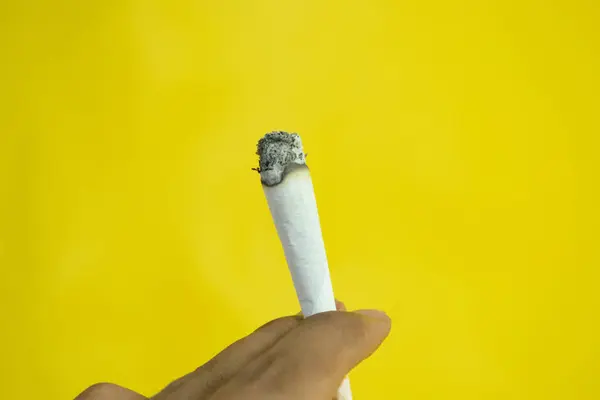 Man Hand Holds Handmade Cigarette Yellow Background — Stock Photo, Image