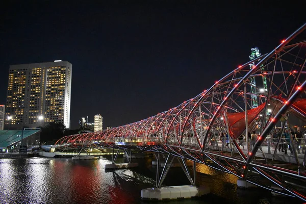 stock image Helix Bridge  is a pedestrian bridge linking Marina Centre with Marina South in the Marina Bay area in Singapore. 