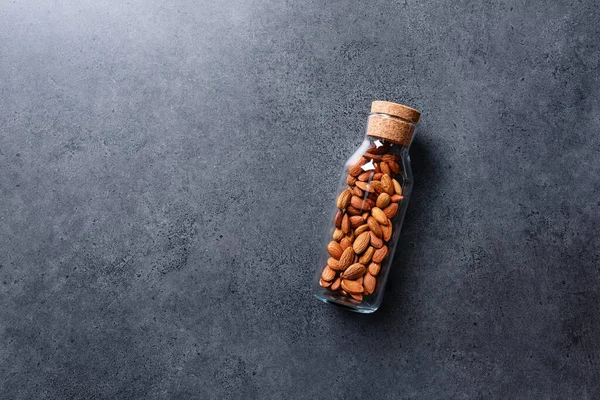 Almond Nuts Glass Jar Concrete Desktop Top View Copy Space — Stock Photo, Image