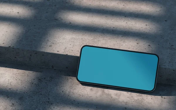 スマートフォンのモックアップは 具体的な表面に 屋外に横たわっていた 3Dレンダリング — ストック写真