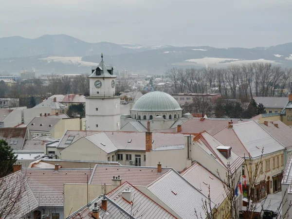 The first snow on the roofs and in the streets of the historical center of the city of Trencin in Slovakia. Europe.