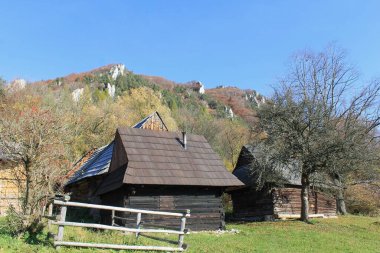 An abandoned settlement in the Slovak mountains of Velka Fatra. Wooden houses in the middle of wild nature.