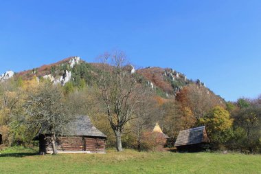 An abandoned settlement in the Slovak mountains of Velka Fatra. Wooden houses in the middle of wild nature.