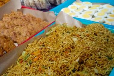 Various menu of indonesian food , fried noodle , fried tempeh, boiled eggs
