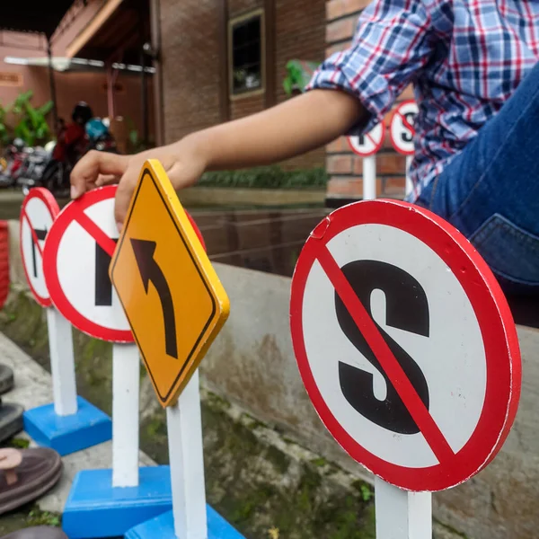 Kid playing with the traffic sign toys, educational games for preschool children