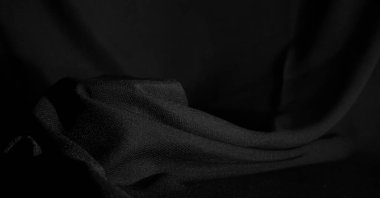 Siyah kumaşın arkaplan dokusu veya deseni.