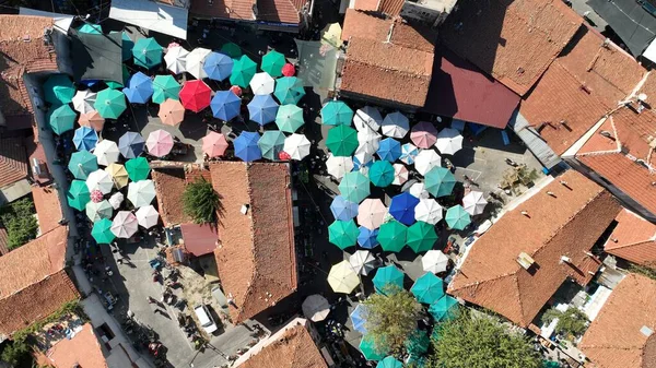 aerial view of colorful umbrellas in the marketplace