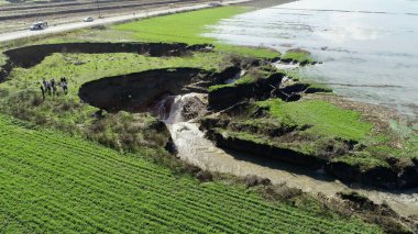 aerial view of underground sinkhole waterfall as water flows photo