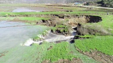 aerial view of underground sinkhole waterfall as water flows video