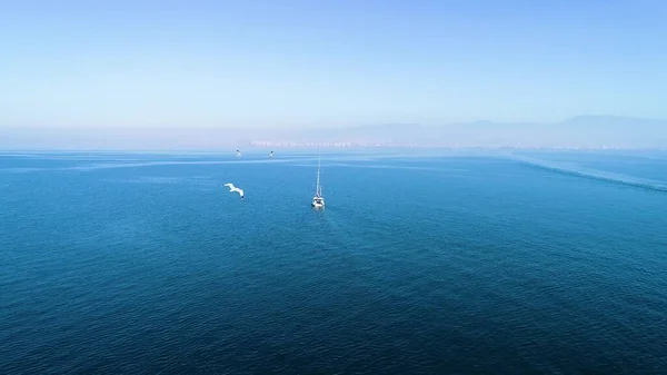 Aerial tracking of the sailing boat sailing to the Aegean Sea with drone. High quality 4k footage