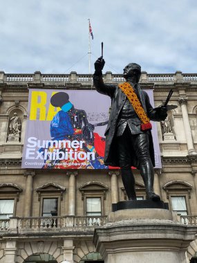 Royal Academy of Arts Summer Exhibition, 2021. Staue of Joshua Reynolds with exhibition poster. London, England, September 17,2021. 