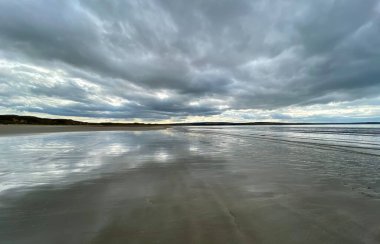 Carradale Bay Beach, Scottish Highlands, Beach and sea under heavy sky. 