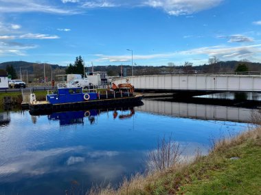 Working Boat Selby on The River Ness. Blue sky refelcting on the water. Inverness, Scotland, January 28, 2023. 