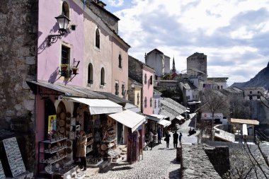 Mostar, Bosnia and Herzegovina. March 2020. Colourful buildings, street scene, shops and restaurants. On the River Neretva. 