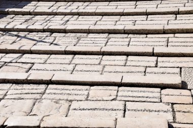 Stone Stepped footpath. Old Mostar Bridge, Bosnia and Herzegovina. Textured red stone. Light and shadow. 