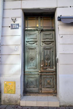  Old Rustic Green door in Building in Krakow Old Town.  Krakow, Poland, February 12, 2022.