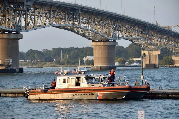 stock image US Coastguard boats moored in the York River off Yorktown beach under the Coleman Memorial Bridge. Yorktown VA, USA. 