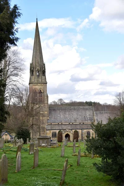 stock image St Peters Parish Church. 1870. Parish Church on The Chatsworth Estate, with graveyard. Edensor, Derbyshire, England. March 17, 2023. 