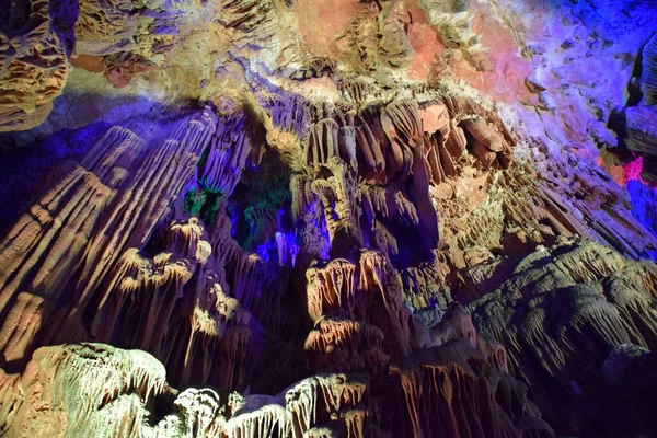 Colourful underground Cave Rock Formations. Guilin, China.